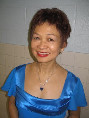 Smiling woman in blue satin dress