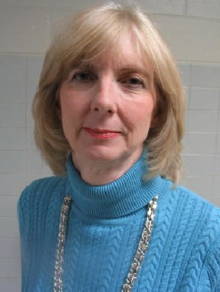 Woman wearing blue sweater and silver necklace